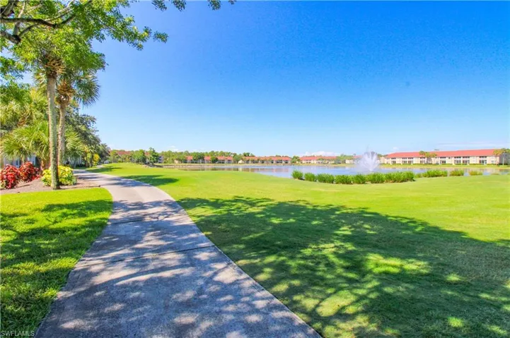View of nearby features featuring a yard and a water view