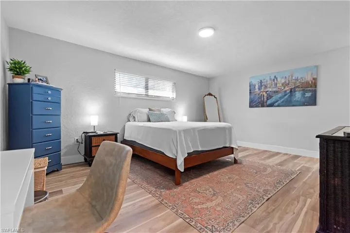 Large primary bedroom features a walk-in closet