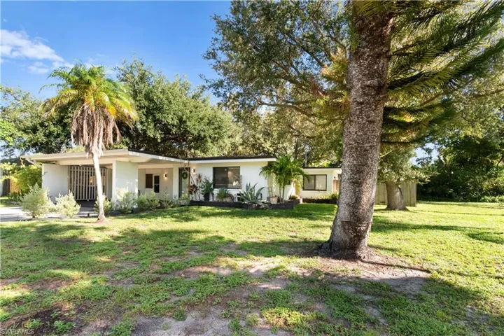 Ranch-style home featuring a spacious yard and fenced backyard