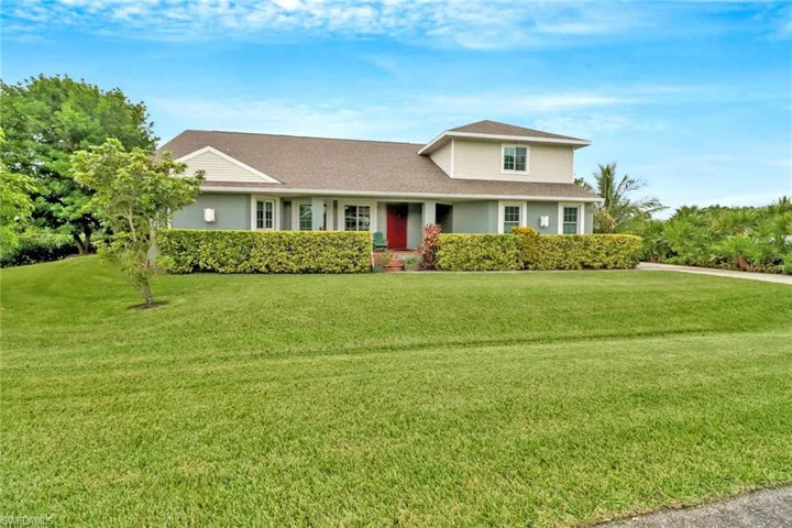 View of front of property with a front lawn