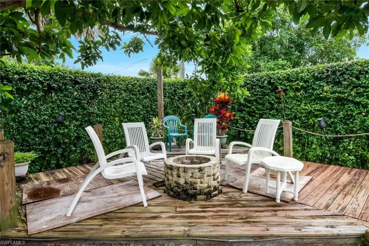 Wooden deck featuring a fire pit