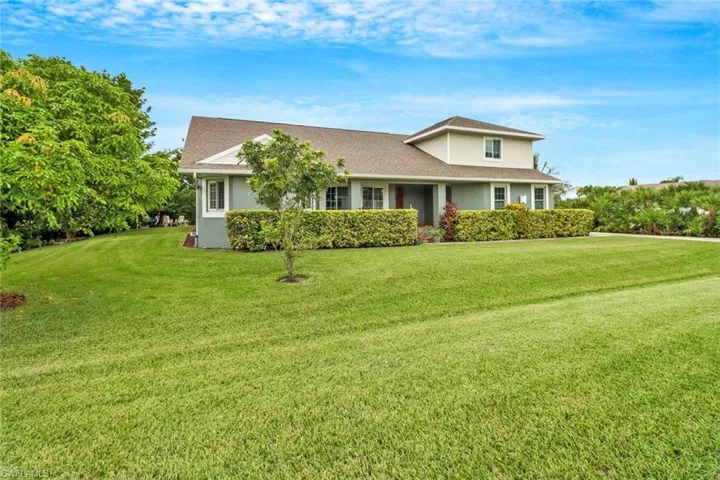 View of front of property with a front yard