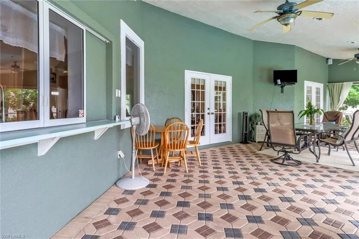 View of patio / terrace featuring french doors and ceiling fan