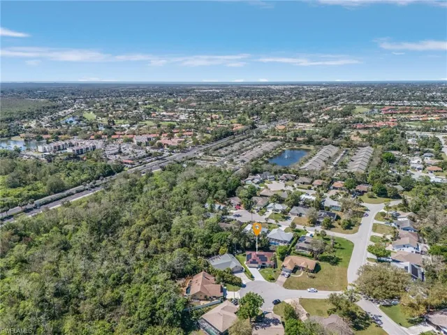 Bird's eye view with a water view and a residential view