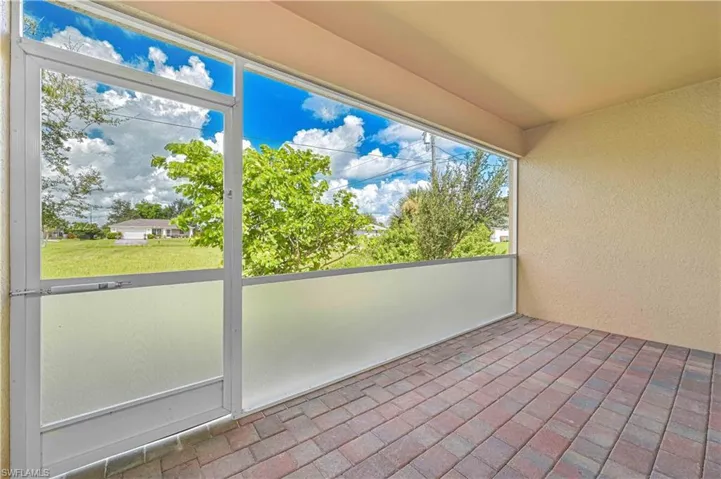 Unfurnished sunroom featuring a balcony
