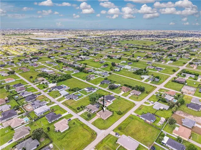 Aerial overview of property's location with nearby suburban area