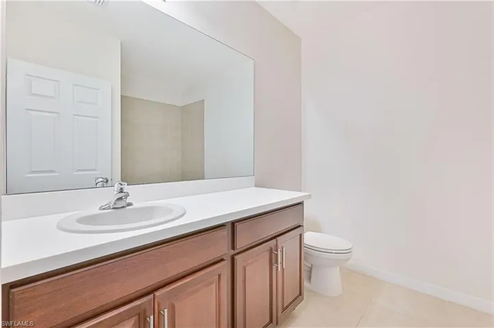 Bathroom featuring vanity and light tile patterned flooring