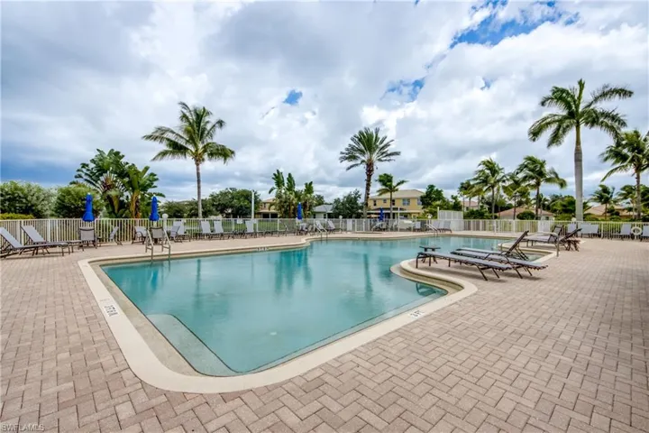 Community pool featuring a patio