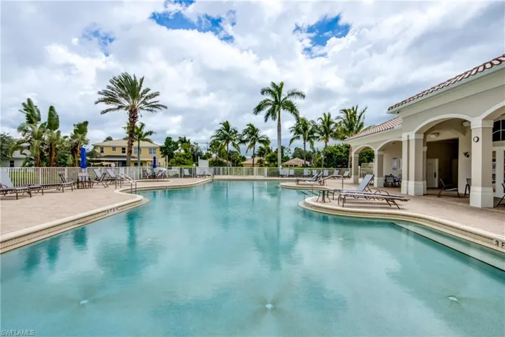 Community pool with a patio