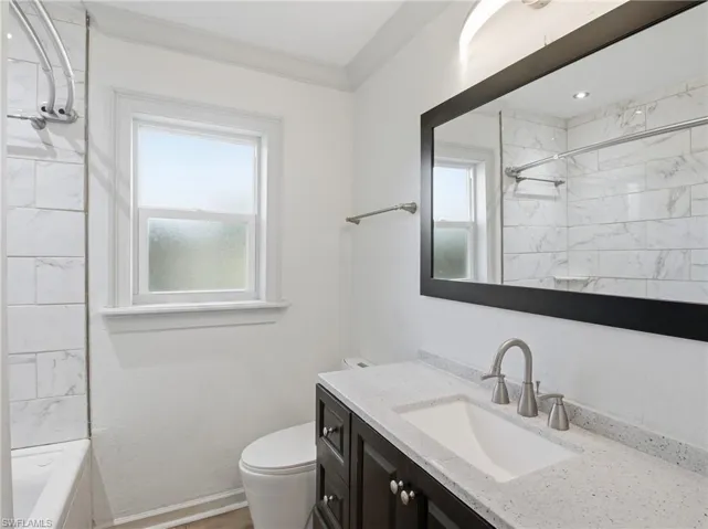 Full bathroom featuring vanity and  shower combination