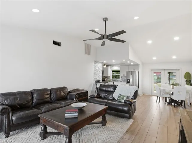 Living area featuring recessed lighting, light wood finished floors, and ceiling fan