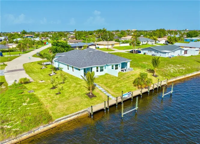 Aerial perspective of suburban area with a large body of water