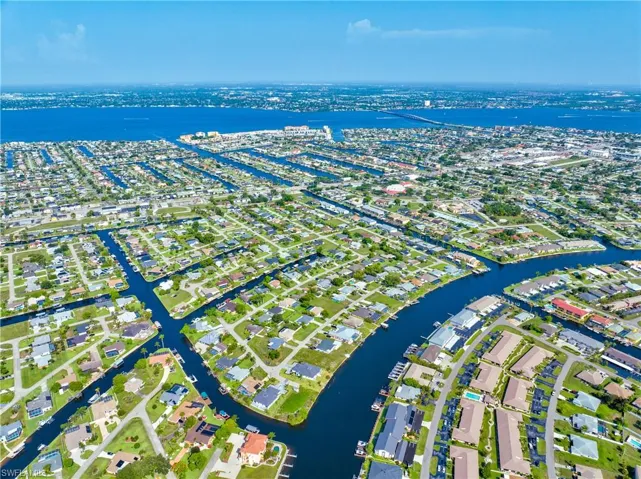 Aerial overview of property's location with a nearby body of water