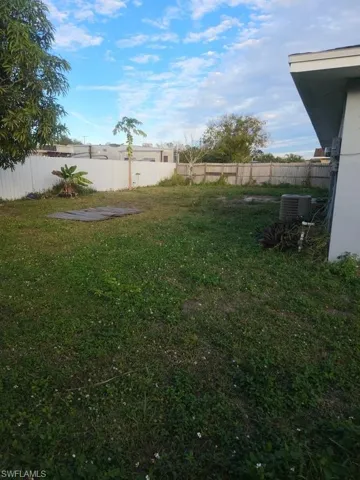 View of fenced backyard
