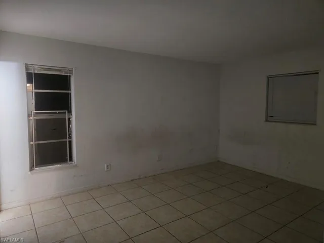 Empty room with tile patterned floors