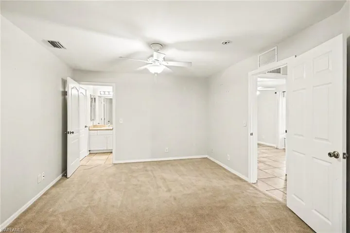 Large den w/French doors; access to bath, front bedroom