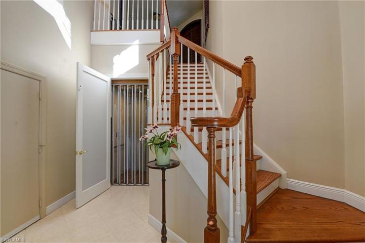 Wooden staircase and elevator door