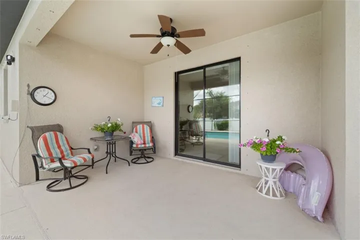 View of patio featuring a ceiling fan