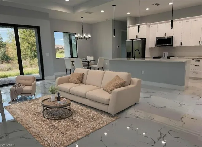 Living room featuring a chandelier, light marble finish flooring, recessed lighting, and baseboards