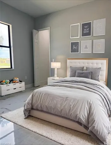 Bedroom with marble finish flooring