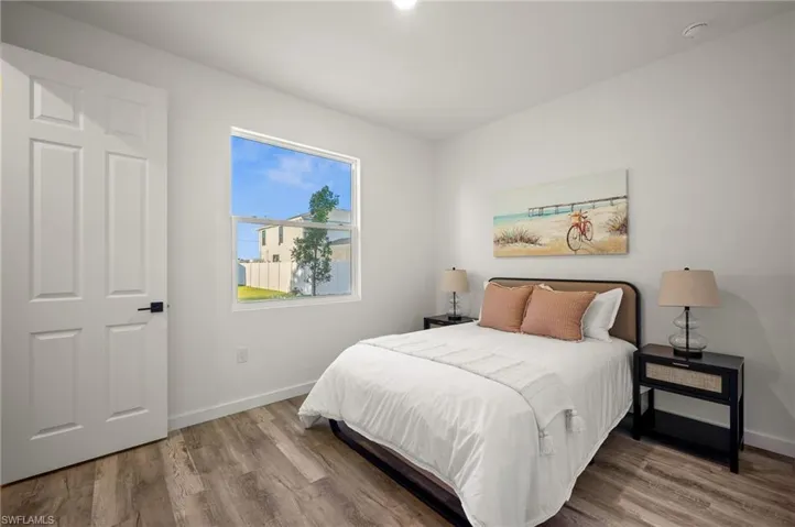 Bedroom with wood-type flooring