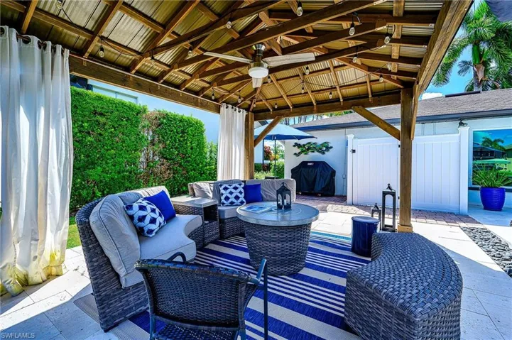 View of patio / terrace with ceiling fan, area for grilling, an outdoor living space, and a gazebo