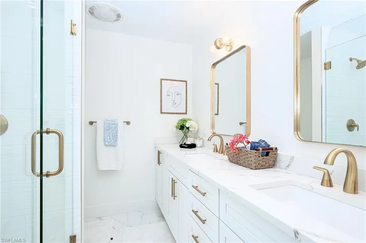 Bathroom with walk in shower and vanity