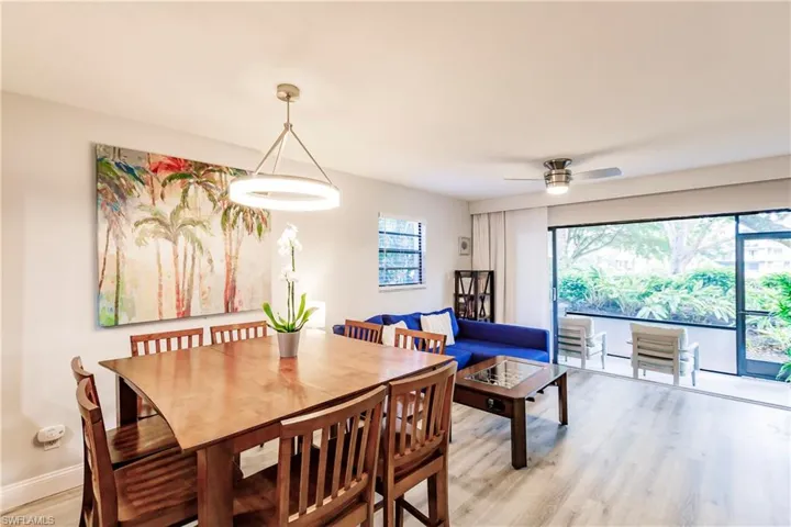 Dining area featuring light wood-style floors and a ceiling fan