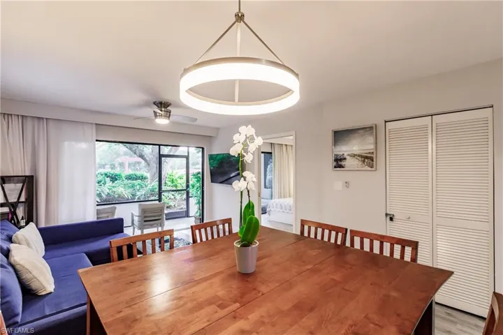 Dining space featuring a ceiling fan and wood finished floors