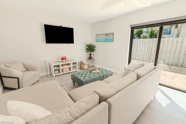 Living room with light hardwood / wood-style floors