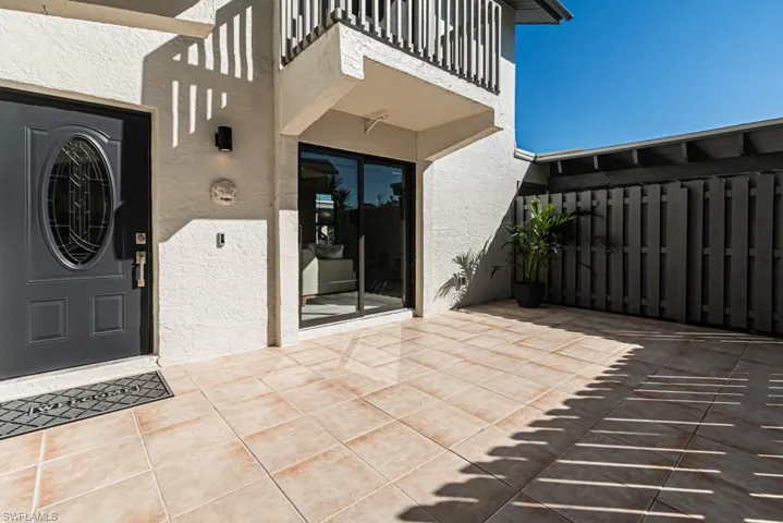 View of patio featuring a balcony