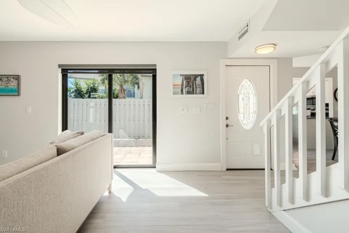 Foyer entrance with light hardwood / wood-style flooring