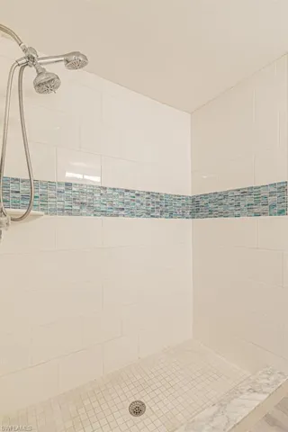 Bathroom featuring tiled shower