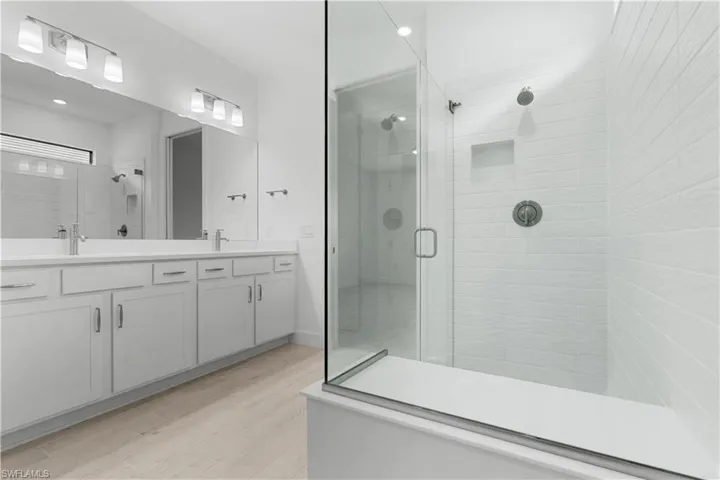 grand primary bathroom with upscale finishes