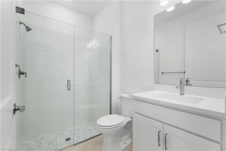 guest bathroom with frameless shower door
