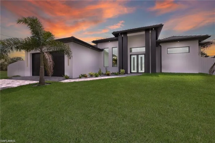 View of front of home with a yard