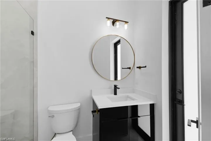 Bathroom with oversized vanity and toilet