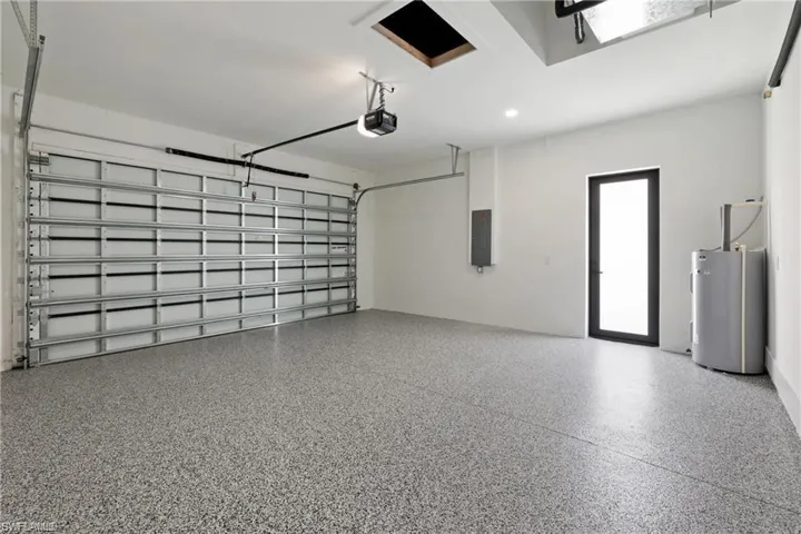 Garage with a garage door opener and water heater