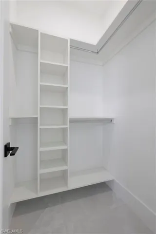 Walk in closet featuring tile flooring