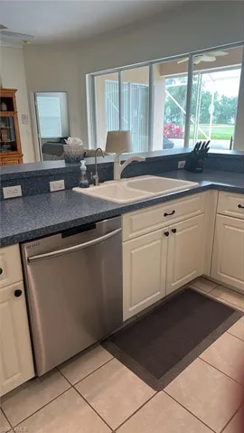 Kitchen area with sink and faucet