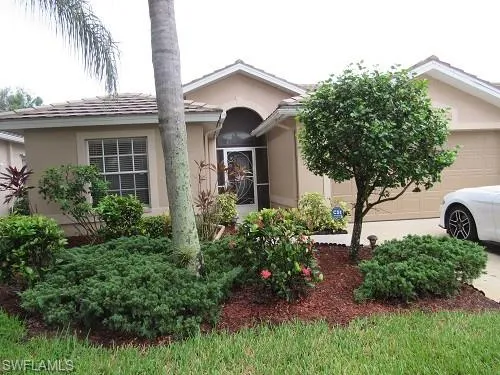 View of front of building and 2 car attached garage
