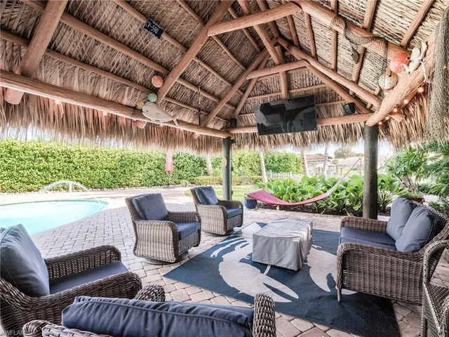 After boating all day, jump in your saltwater swimming pool and relax under the tiki listening to the palm trees blowing in the wind