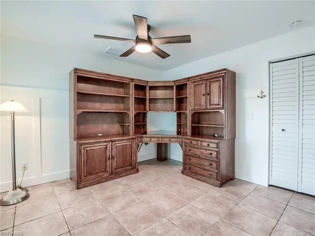 Large Den off the front entrance and paver patio