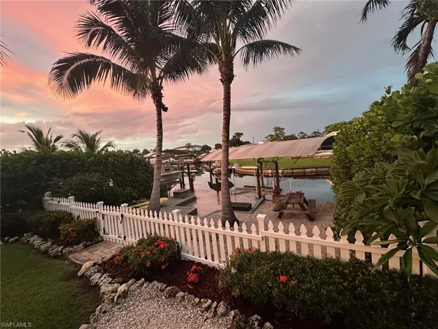 Lookiing down to the dock from the fire pit sitting area at sunset