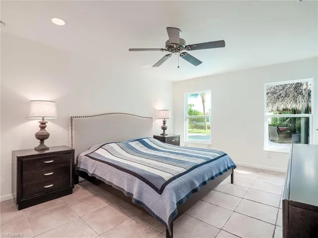 primary bedroom located off the large pavered patio and tiki hut