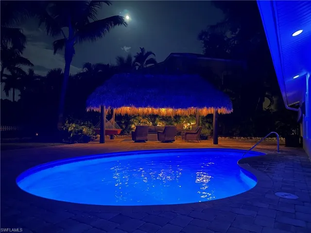 The outdoor living doesn't need to stop when the sun goes down! Enjoy your heated & lighted saltwater pool while hanging out in the tiki hut