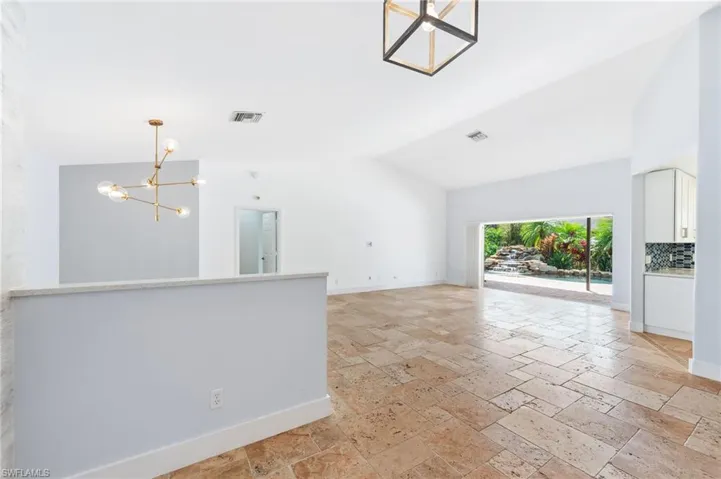Walking in the front door to living room, and out to pool.