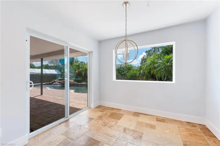 Breakfast nook looking to pool and backyard.