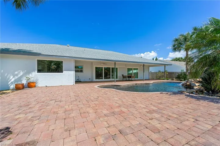 View of pool featuring a fenced in pool, a patio, a ceiling fan, and fence