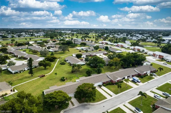 Aerial perspective of suburban area with a large body of water